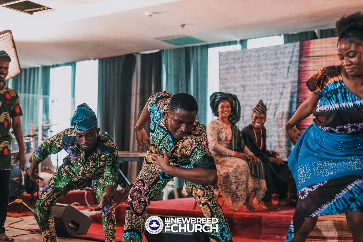 Cultural dancers performing on stage at The New Breed Church