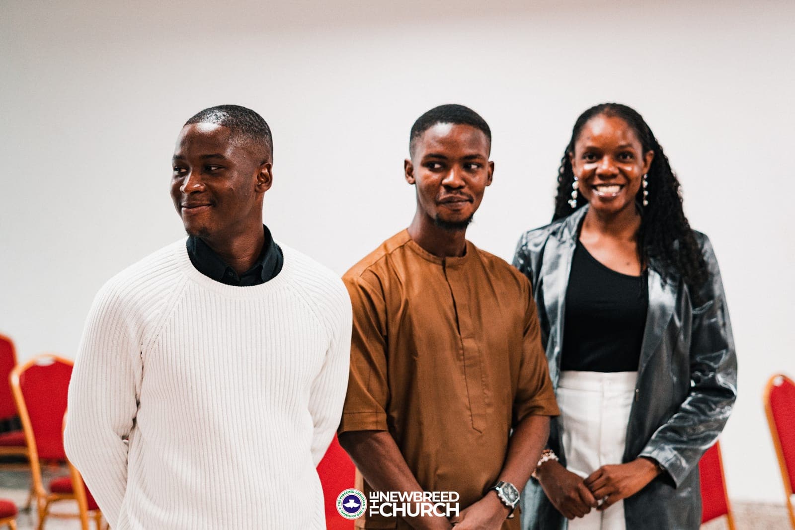 Members of The New Breed Church welcoming a guest